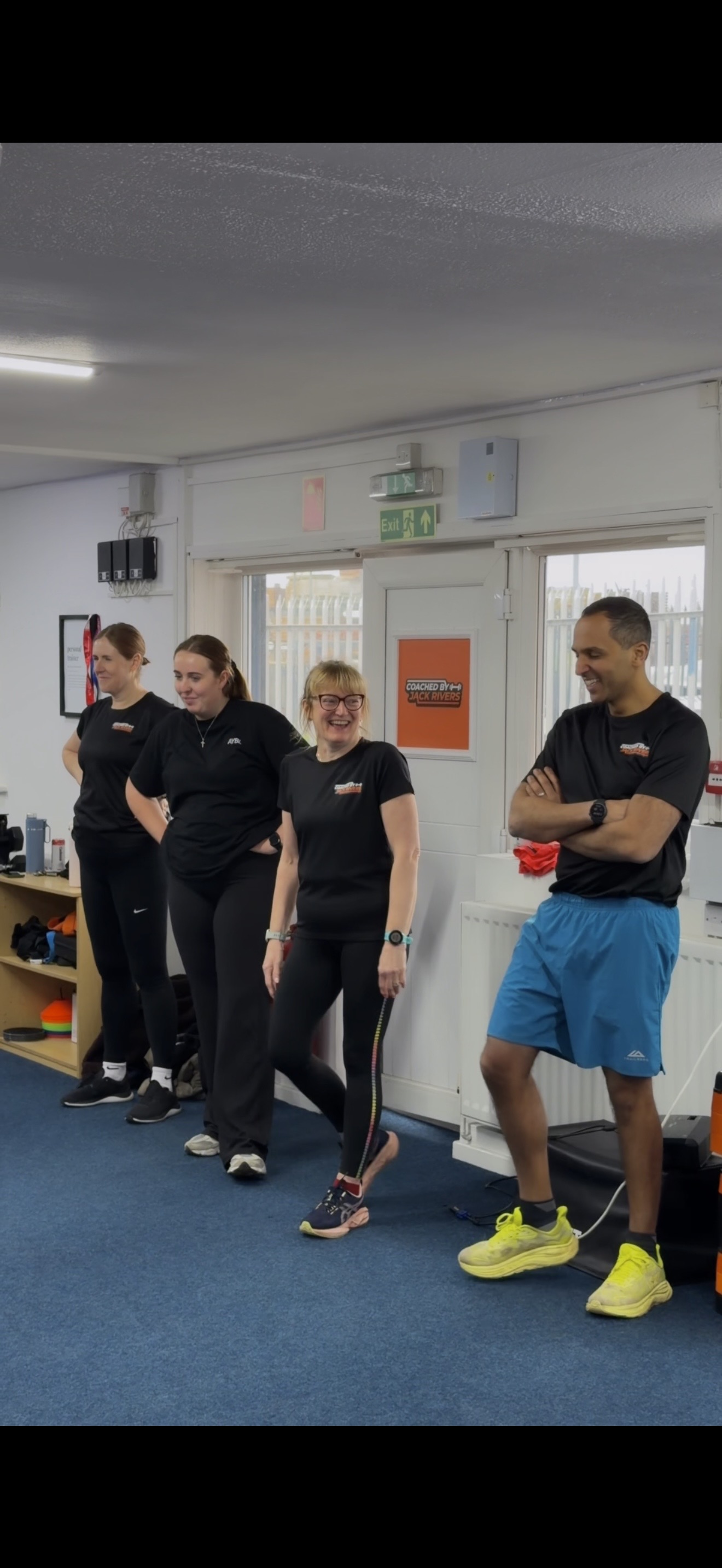 Group of clients laughing together in the studio